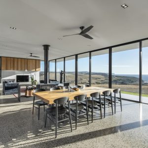 two black infinity ceiling fans in a modern living room