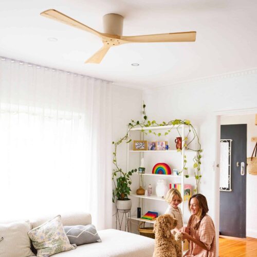 Fanco Gaia 54 inch DC timber ceiling fan in modern Australian living room with family and dog